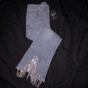flare bottom jeans with crystals on the bottom